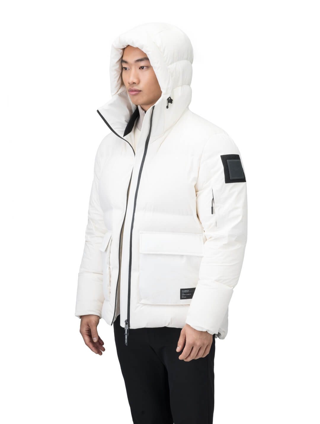 Supra Men's Performance Puffer in hip length, Technical Taffeta and 3-Ply Micro Denier fabrication, Premium Canadian White Duck Down insulation, non-removable down filled hood, centre front two-way zipper, flap pockets at waist, and zipper pocket at left bicep, in Wheat Desert