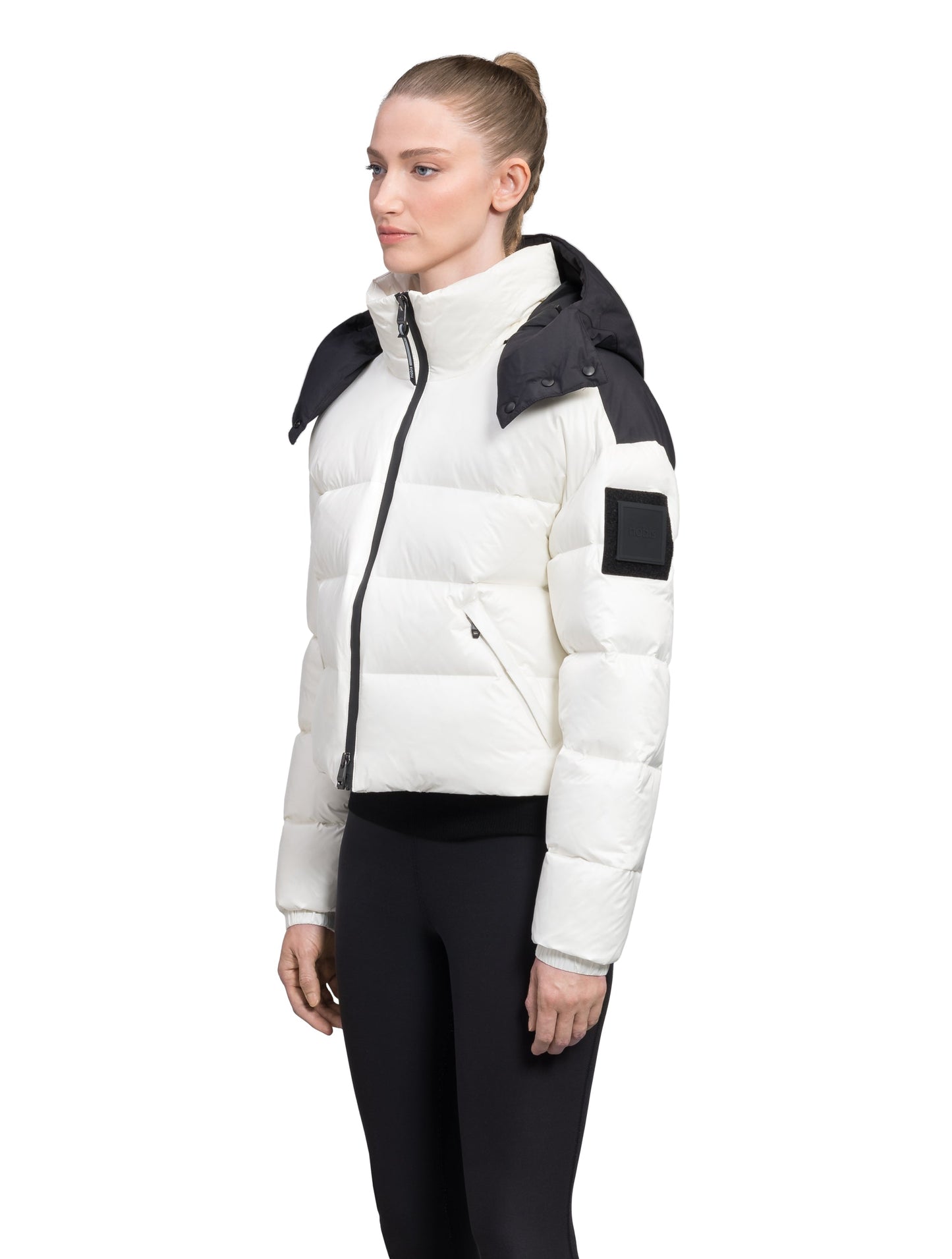 Tempus Women's Performance Short Puffer Jacket in waist length, premium technical nylon taffeta fabrication, Premium Canadian origin White Duck Down insulation, removable down-filled hood, two-way centre-front zipper, fleece-lined zipper pockets at waist, pit zipper vents, in Chalk