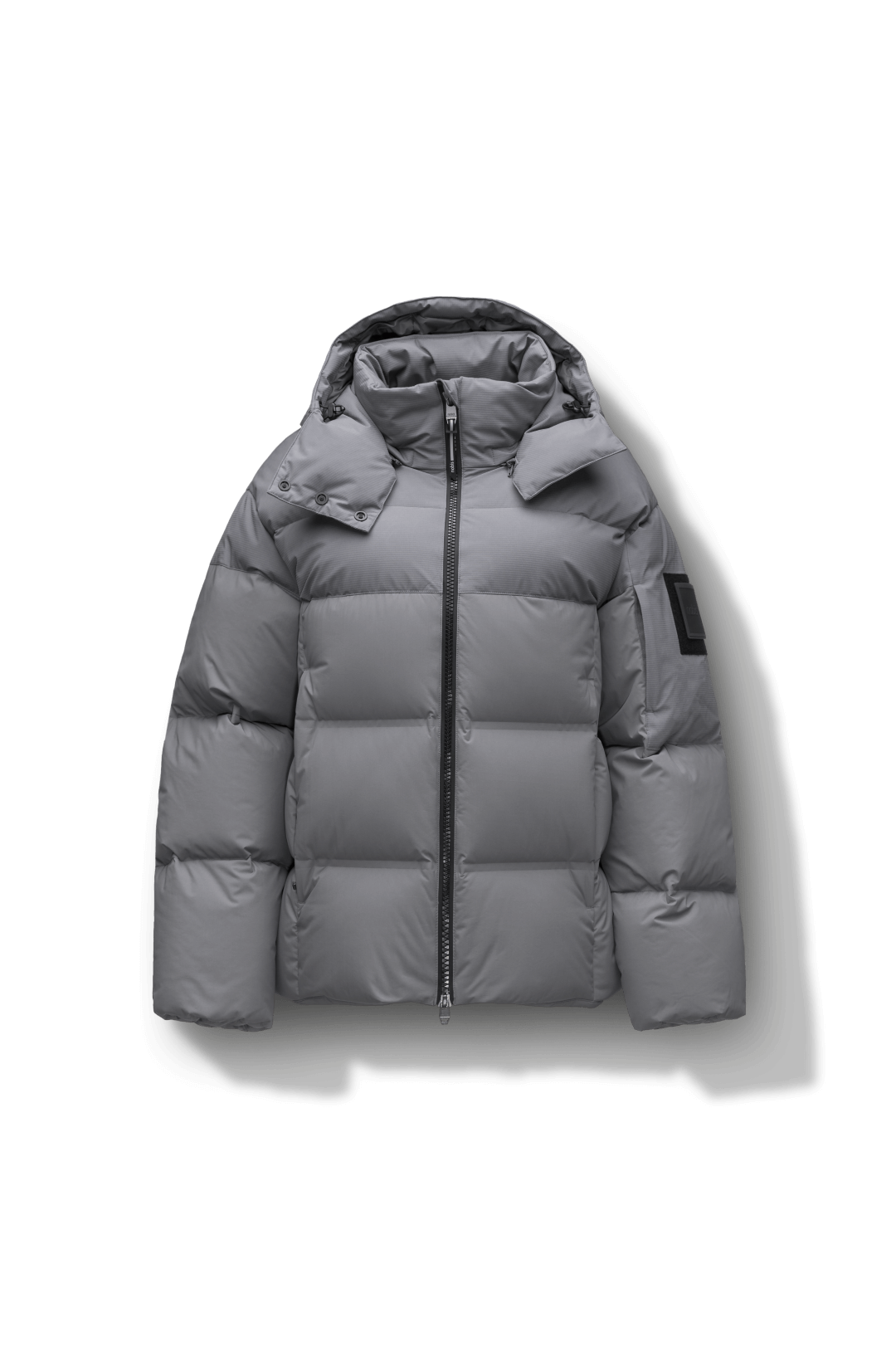 Una Ladies Performance Puffer in hip length, Technical Taffeta and Durable Stretch Ripstop fabrication, Premium Canadian White Duck Down insulation, removable down filled hood, centre front two-way zipper, and side-entry pockets at waist, in Concrete