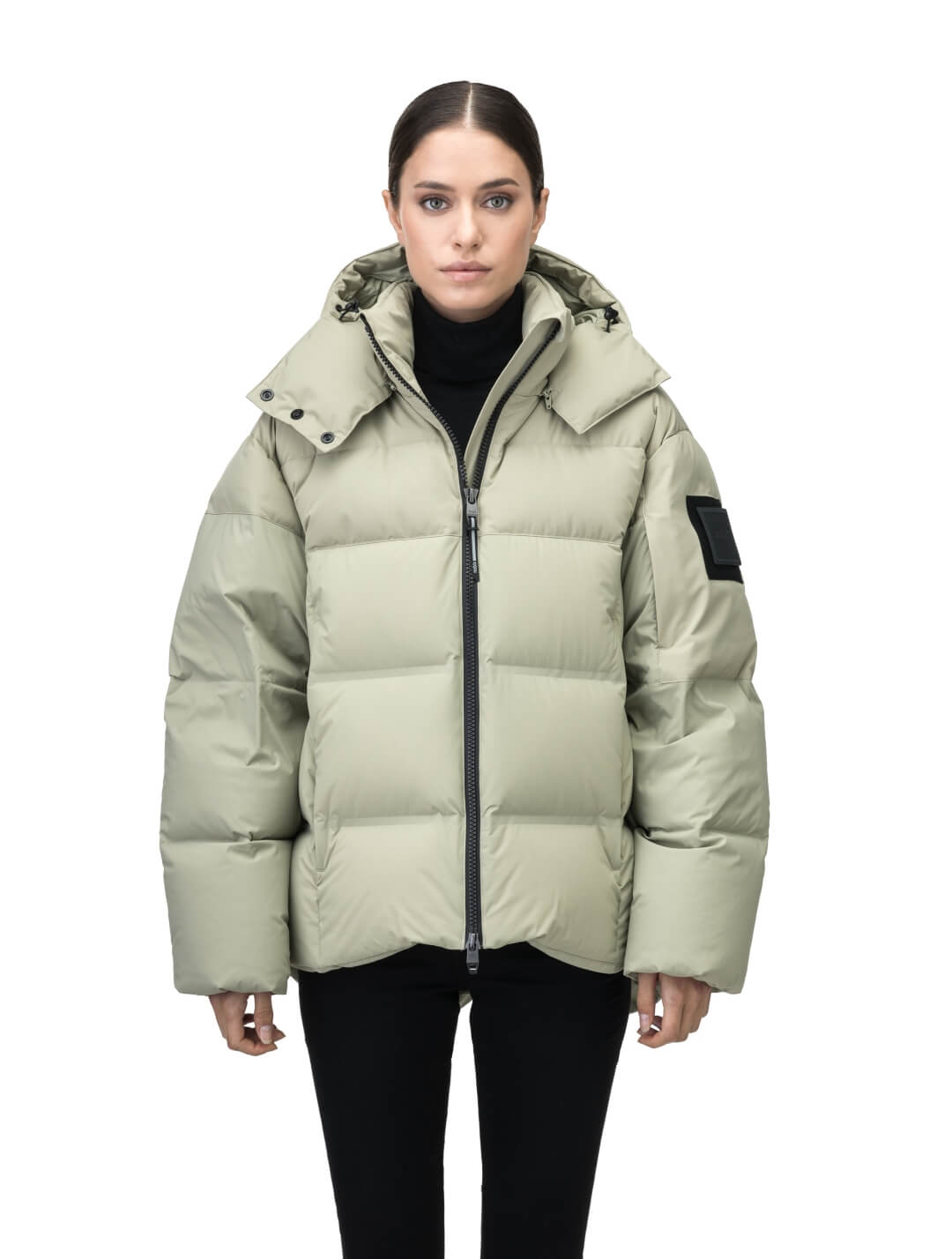 Una Ladies Performance Puffer in hip length, Technical Taffeta and Durable Stretch Ripstop fabrication, Premium Canadian White Duck Down insulation, removable down filled hood, centre front two-way zipper, and side-entry pockets at waist, in Tea