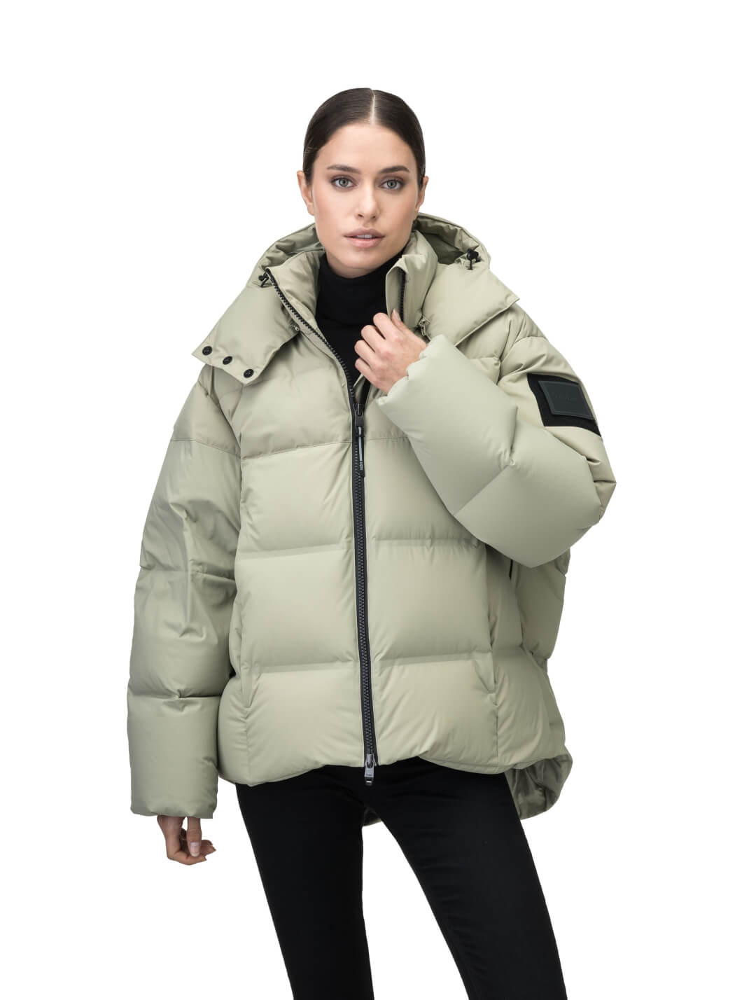 Una Ladies Performance Puffer in hip length, Technical Taffeta and Durable Stretch Ripstop fabrication, Premium Canadian White Duck Down insulation, removable down filled hood, centre front two-way zipper, and side-entry pockets at waist, in Tea