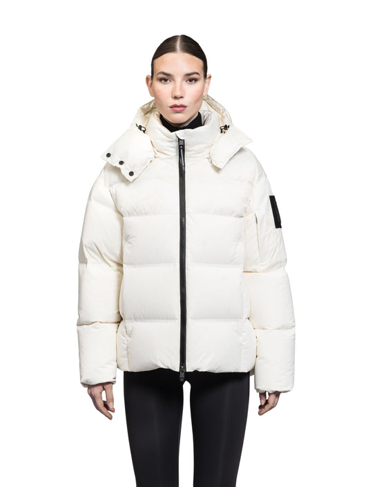 Una Ladies Performance Puffer in hip length, Technical Taffeta and Durable Stretch Ripstop fabrication, Premium Canadian White Duck Down insulation, removable down filled hood, centre front two-way zipper, and side-entry pockets at waist, in Wheat Desert + Wheat Desert