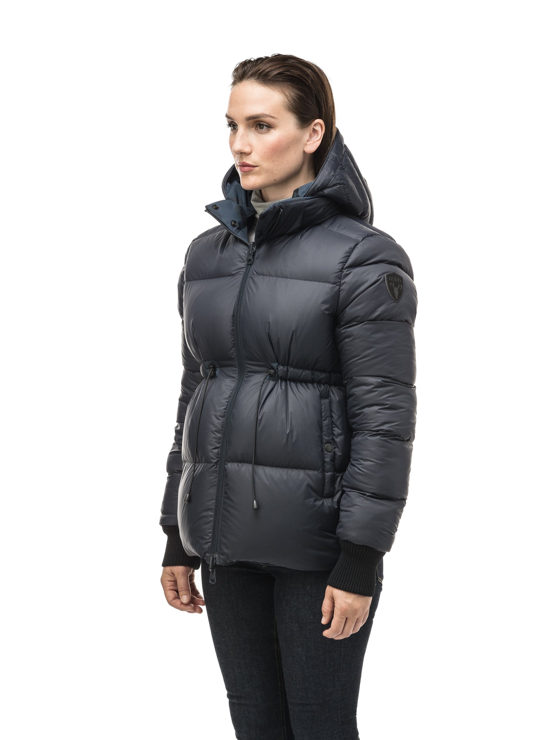 Hip length, reversible women's down filled jacket with waterproof exposed zipper in Navy Camo