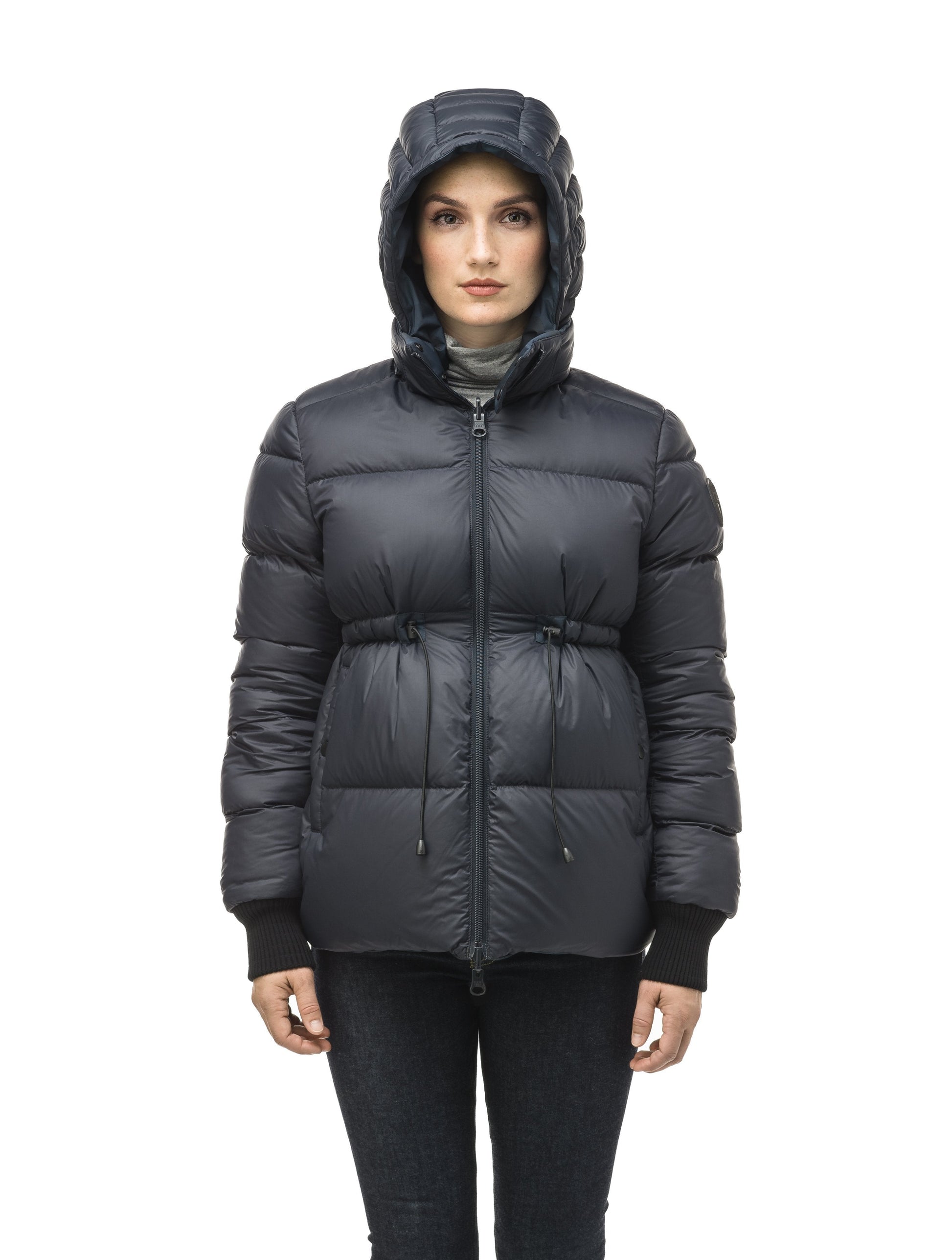 Hip length, reversible women's down filled jacket with waterproof exposed zipper in Navy Camo