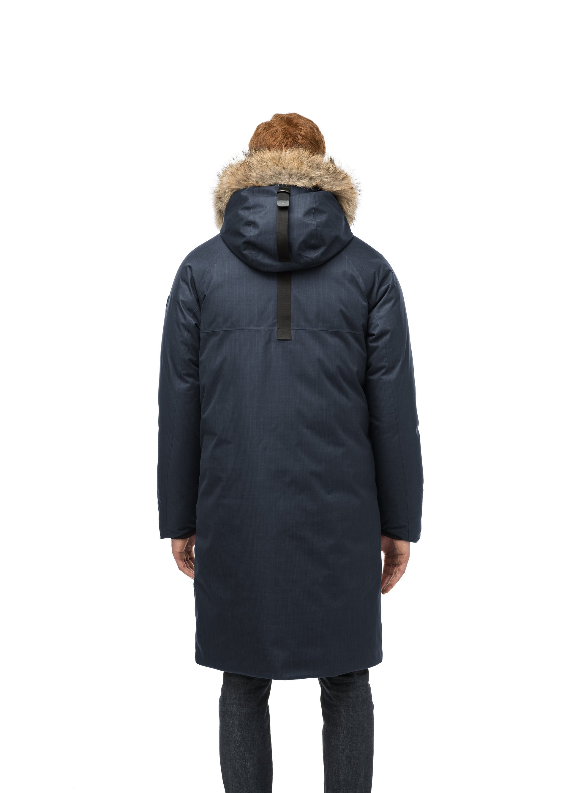 This ankle length men's down filled parka doubles as an over coat with a removable fur trim on the hood in Navy