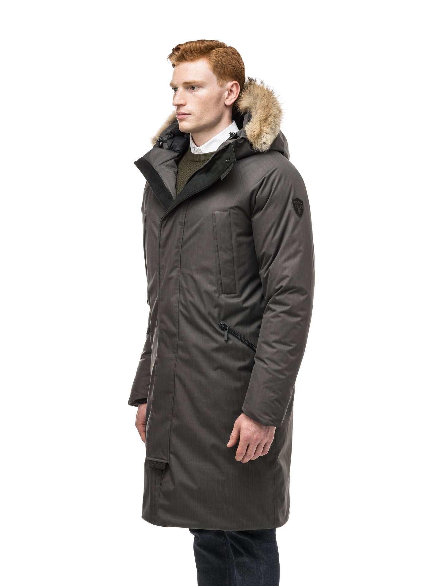 This ankle length men's down filled parka doubles as an over coat with a removable fur trim on the hood in Steel Grey