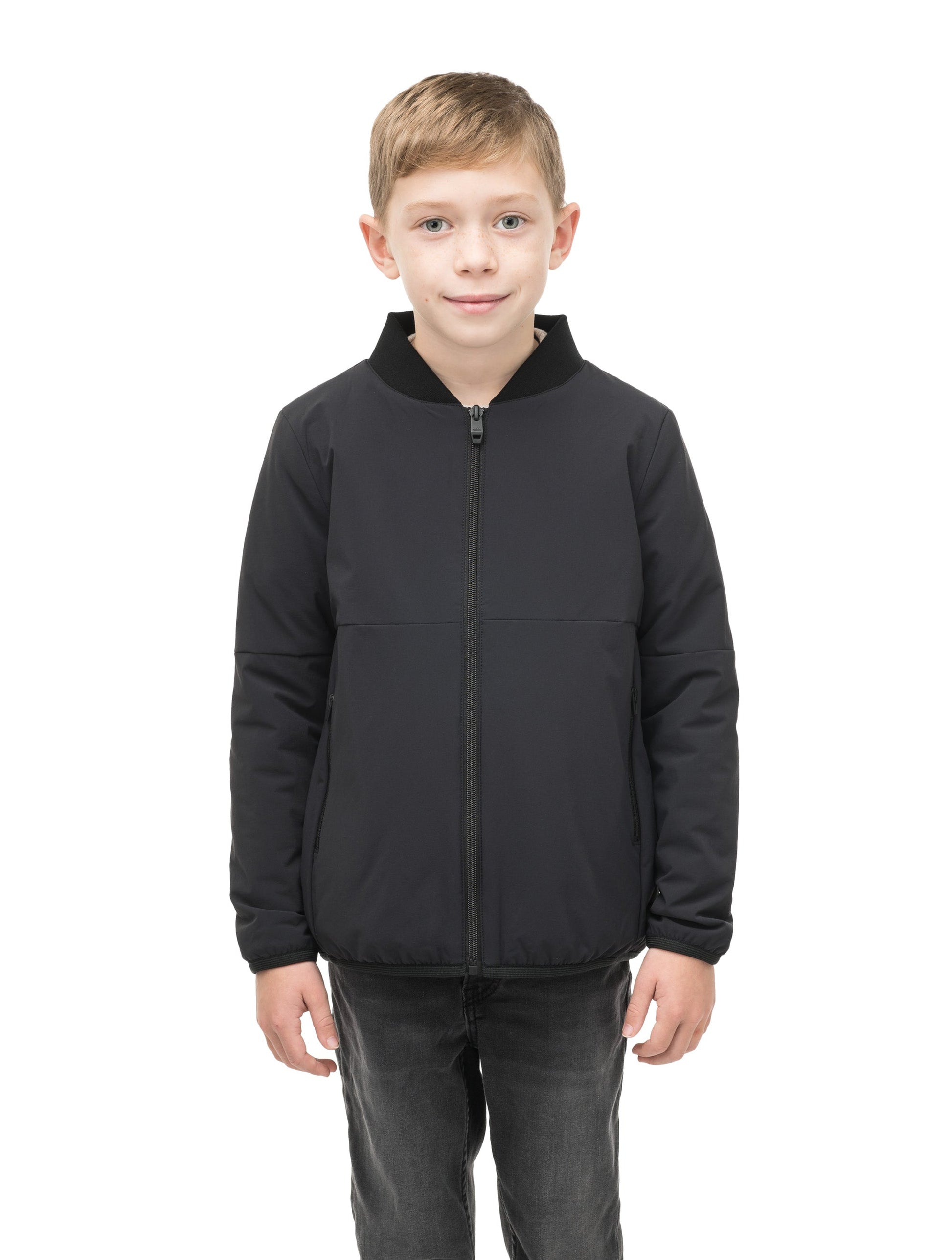 Little Ursa Kids Mid Layer Jacket in hip length, Primaloft Gold Insulation Active, ribbed collar, and two-way front zipper, in Black