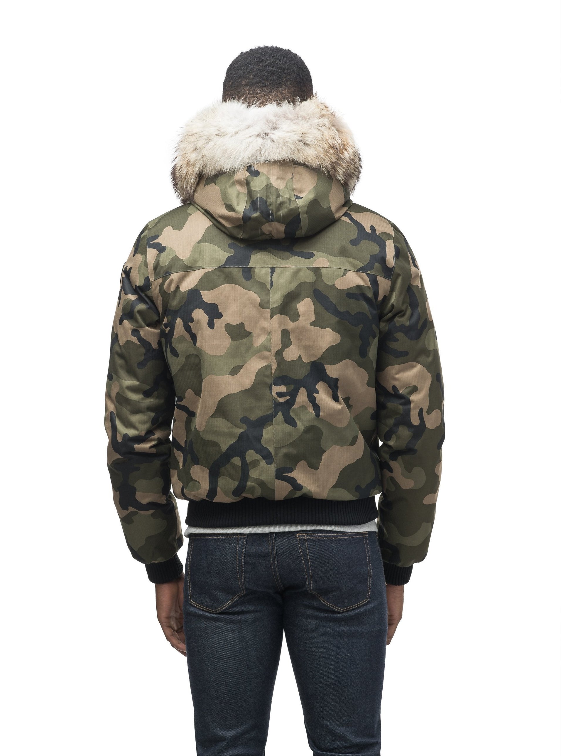 Men's classic down filled bomber jacket with a down filled hood that features a removable coyote fur trim and concealed moldable framing wire in Camo
