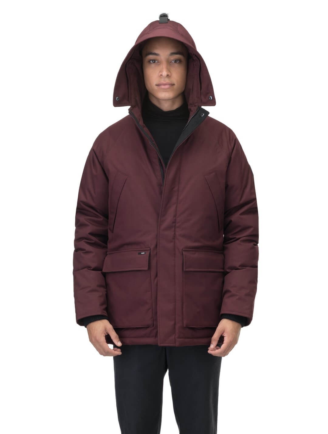 Men's waist length down filled jacket with two front pockets with magnetic closure and a removable fur trim on the hood in Merlot