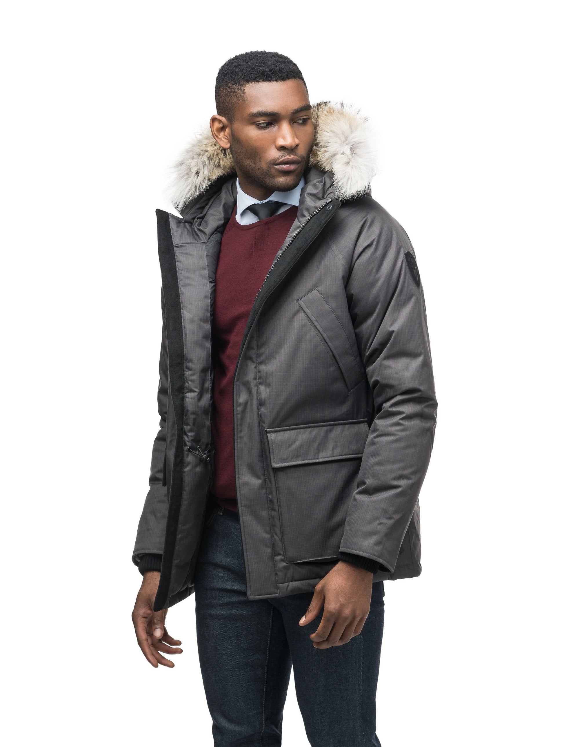Men's waist length down filled jacket with two front pockets with magnetic closure and a removable fur trim on the hood in CH Steel Grey