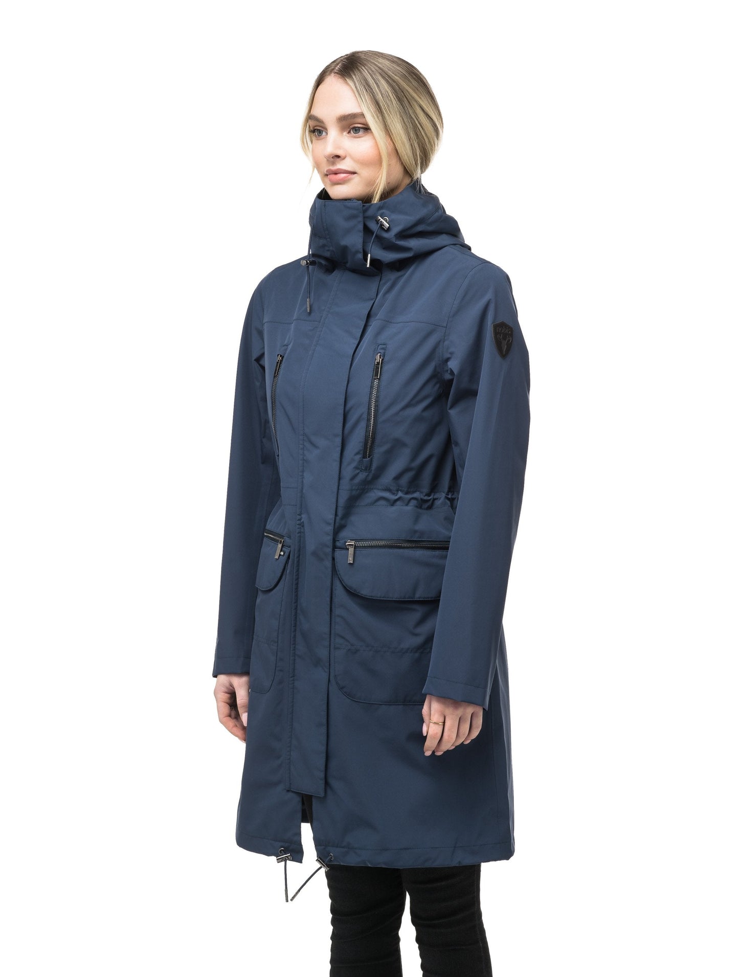 Women's knee length anorak with four front pockets and adjustable cord waist in Marine