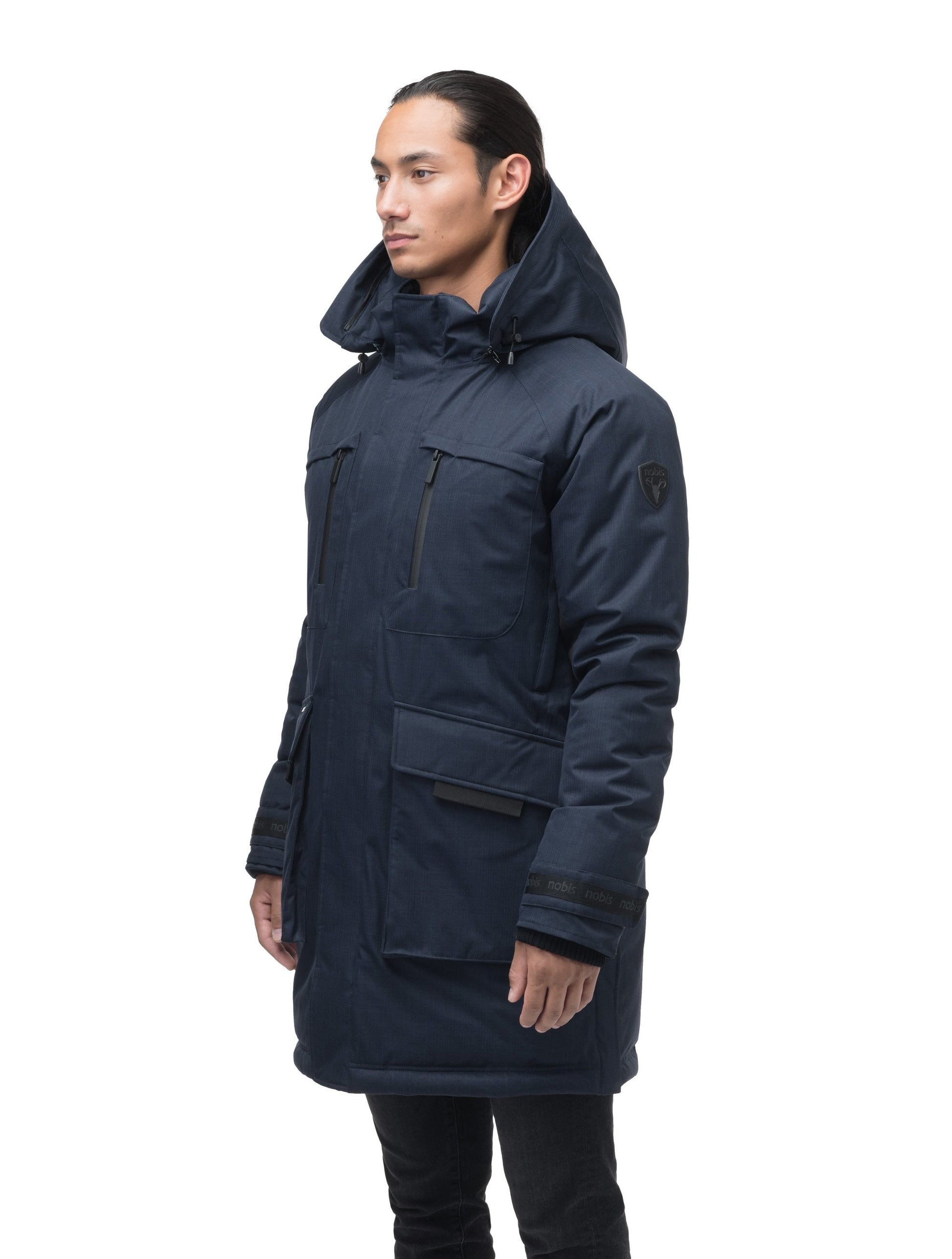Men's thigh length down-filled parka with removable hood and removable coyote fur trim in Navy