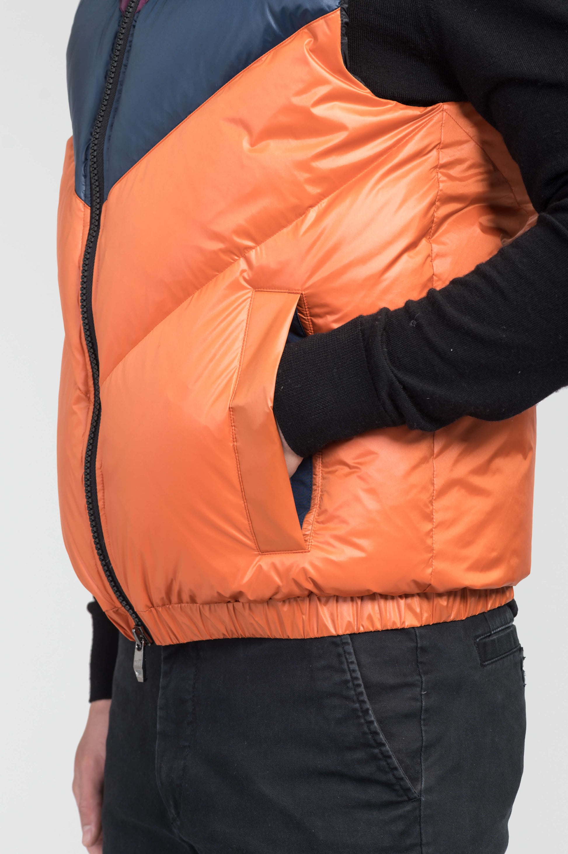 Kylo Men's Chevron Quilted Vest in hip length, premium cire technical nylon taffeta fabrication, Premium Canadian origin White Duck Down insulation, two-way centre-front zipper, fleece-lined pockets at waist, elasticized waistband, in Burnt Orange