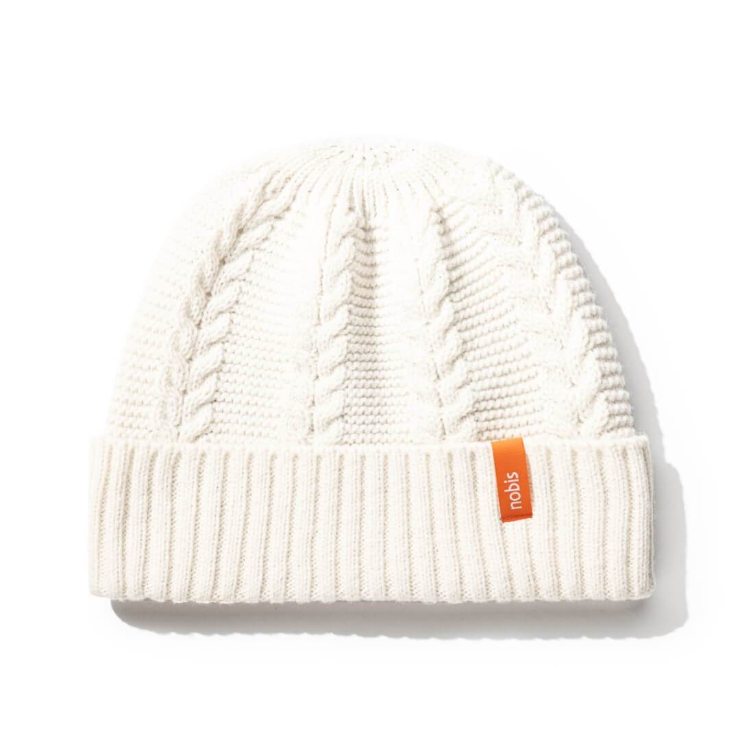 No Cold Shoulder unisex beanie with cable stitched crown, two by two rib knit cuff, with dual orange wrap labels along cuff, in Chalk