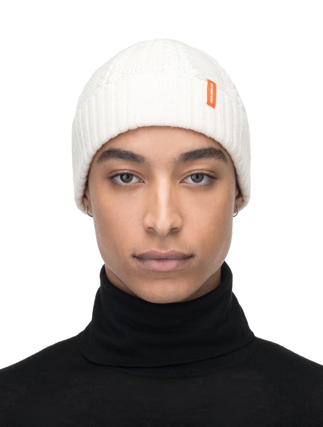 No Cold Shoulder unisex beanie with cable stitched crown, two by two rib knit cuff, with dual orange wrap labels along cuff, in Chalk