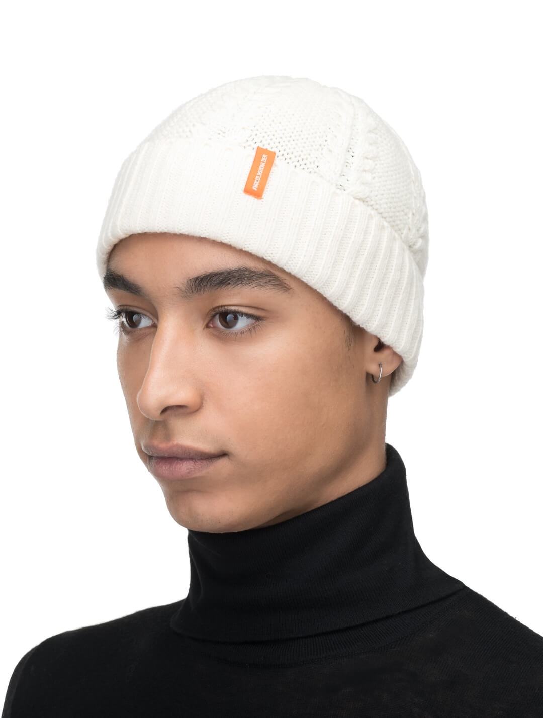 No Cold Shoulder unisex beanie with cable stitched crown, two by two rib knit cuff, with dual orange wrap labels along cuff, in Chalk