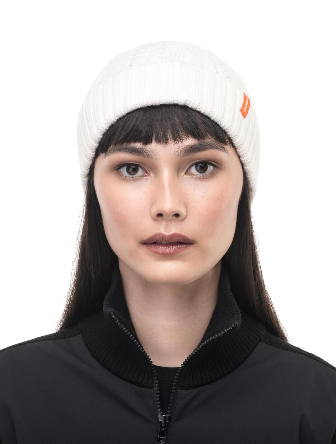 No Cold Shoulder unisex beanie with cable stitched crown, two by two rib knit cuff, with dual orange wrap labels along cuff, in Chalk